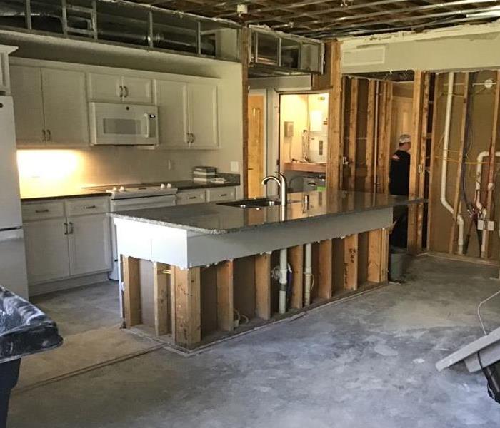 The kitchen has been packet out and all of the drywall and flooring removed from water damage